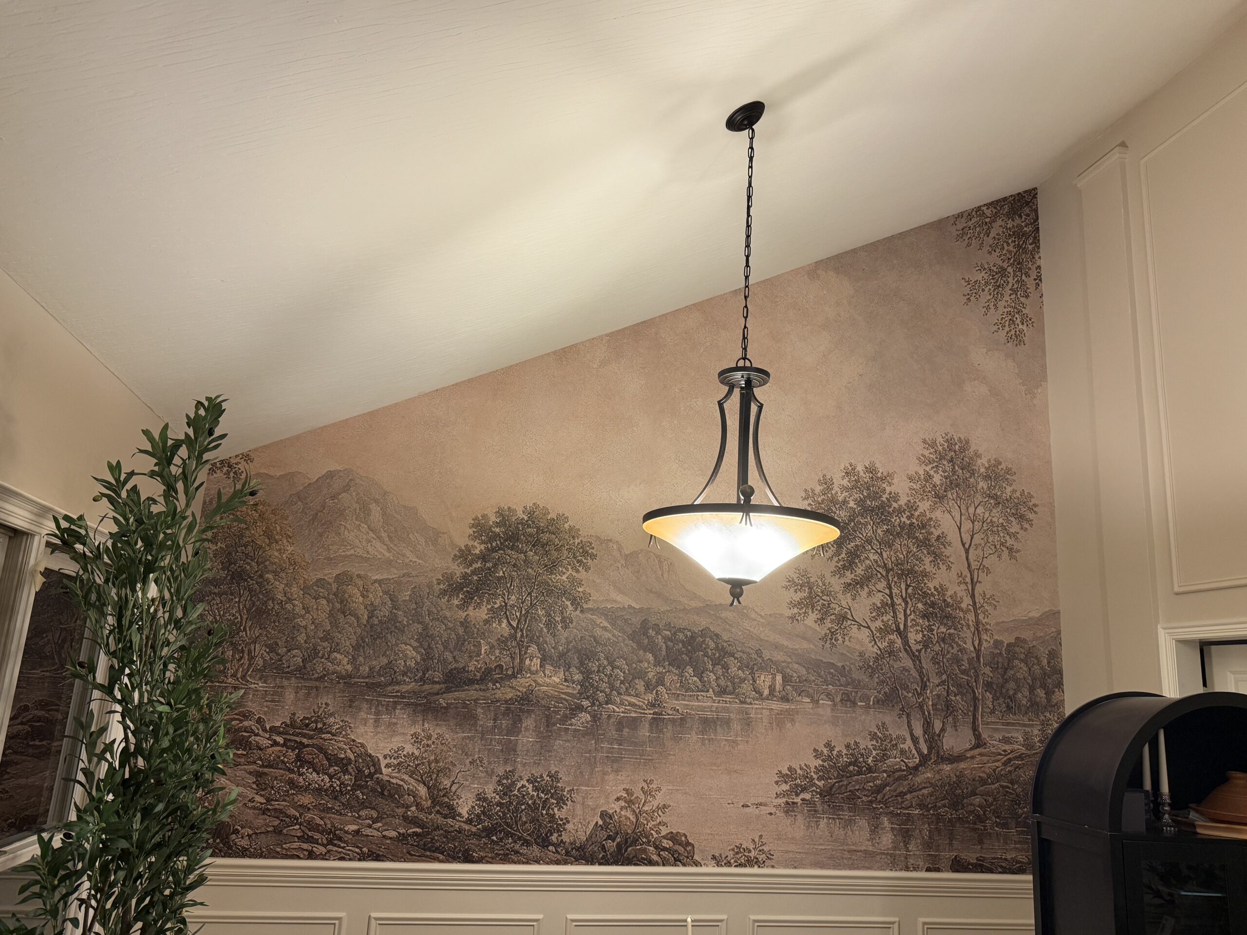 Blue ocean wave mural installation on a bedroom wall